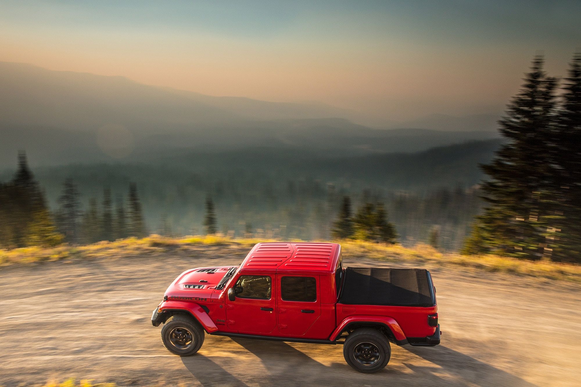 2023 Jeep Gladiator driving up mountainside