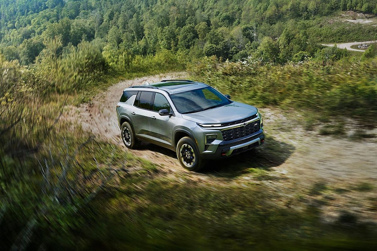 2024 Chevy Traverse Driving Off-Road on a Tree-Lined Path